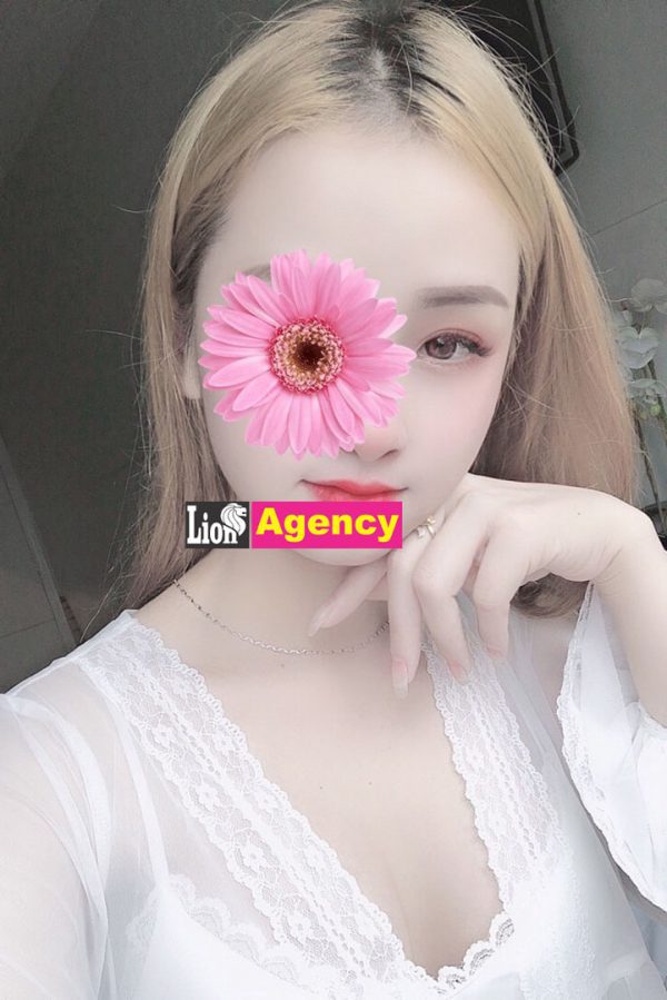 A 207 escort girl with a pink flower on her face.